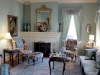 Library at front of home with its original fireplace